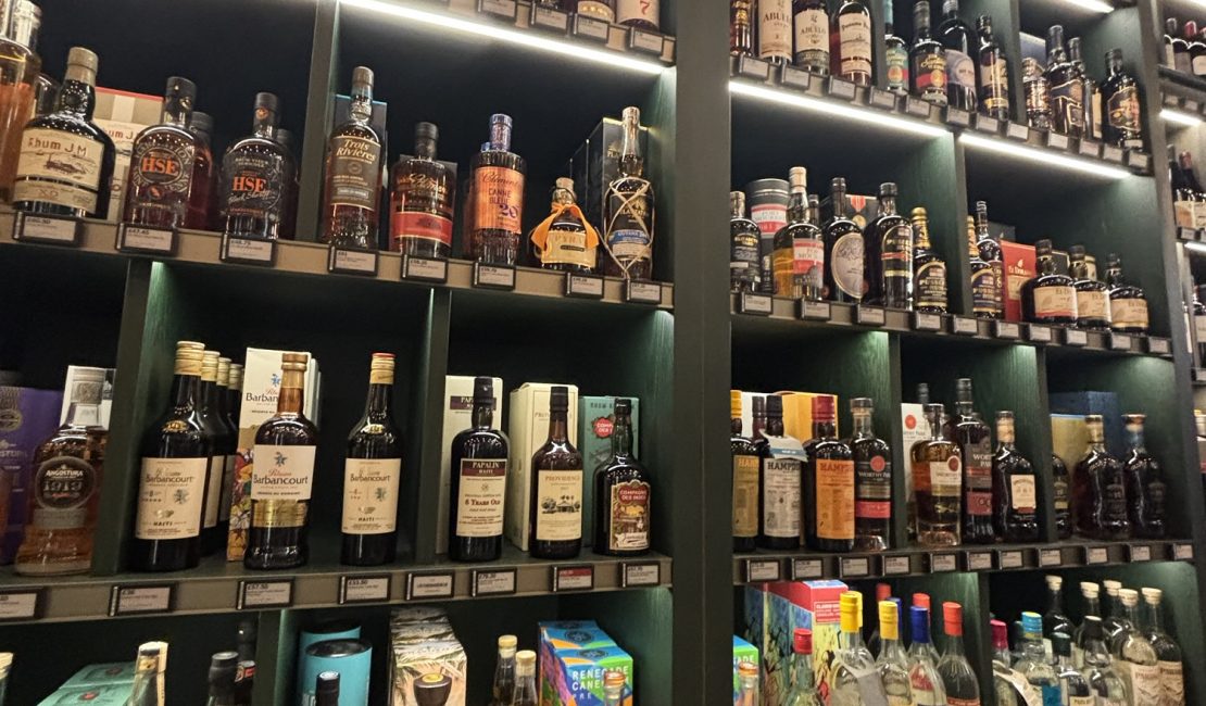 Store shelves stocked with a huge selection of rum