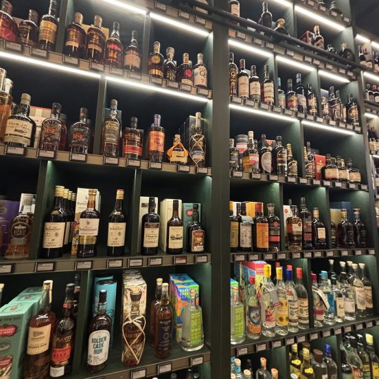 Store shelves stocked with a huge selection of rum